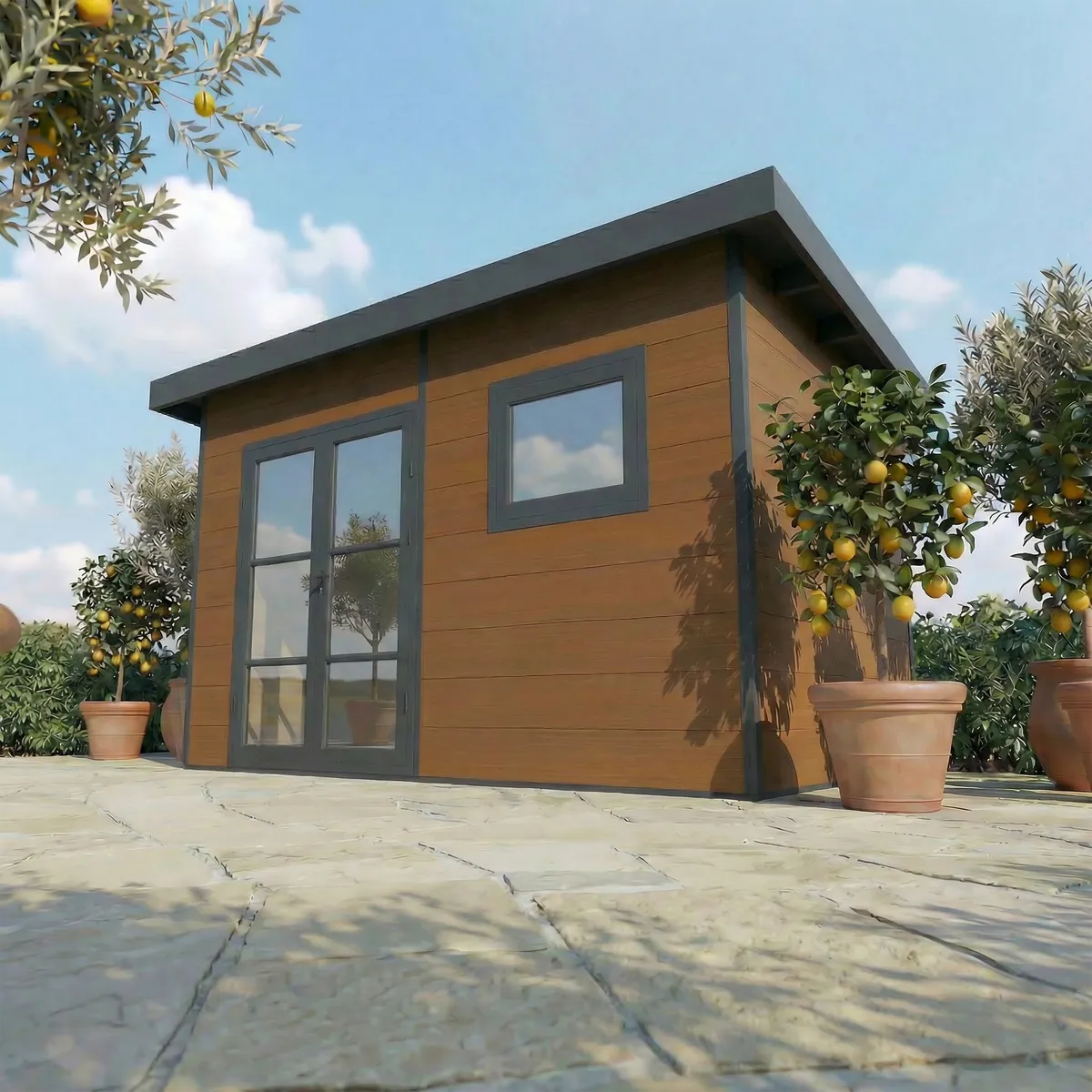 Abri composite Alma 15 m² brun sur une terrasse dallée, citronniers en pot